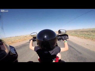 teen boy driving a harley